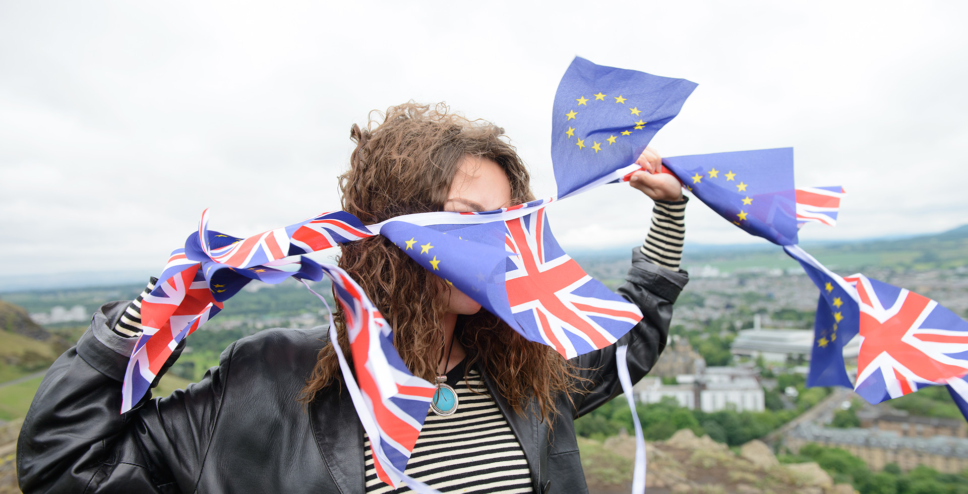 Woman with UK and EU Flags
