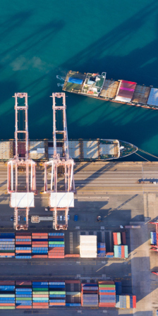 Aerial view sea port warehouse and container ship or crane ship working for delivery containers shipment.