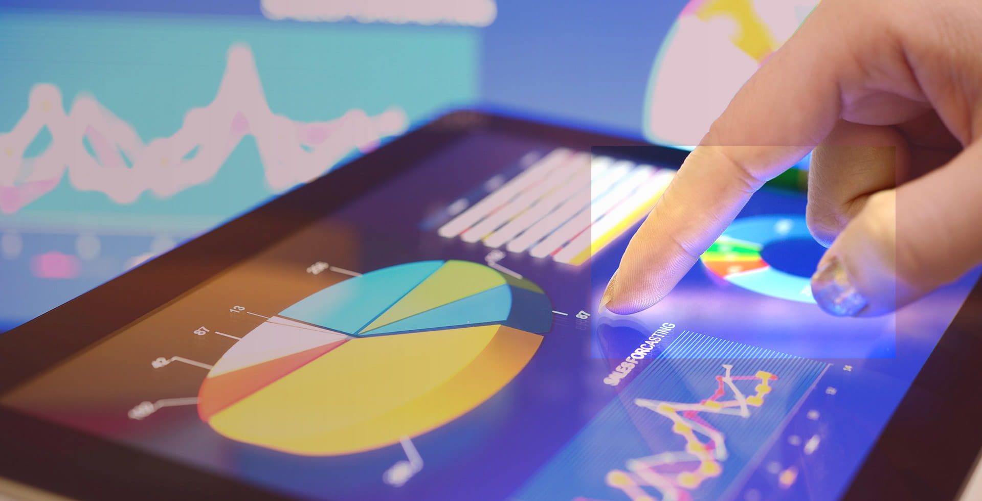 Finger tapping on a tablet display showing a pie chart and performance chart - Portfolio Risk Mitigation without Bonds