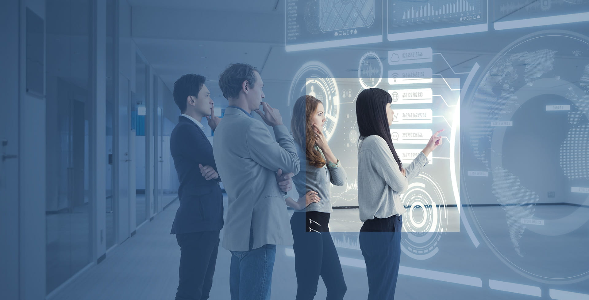 Colleagues gather around a touch screen