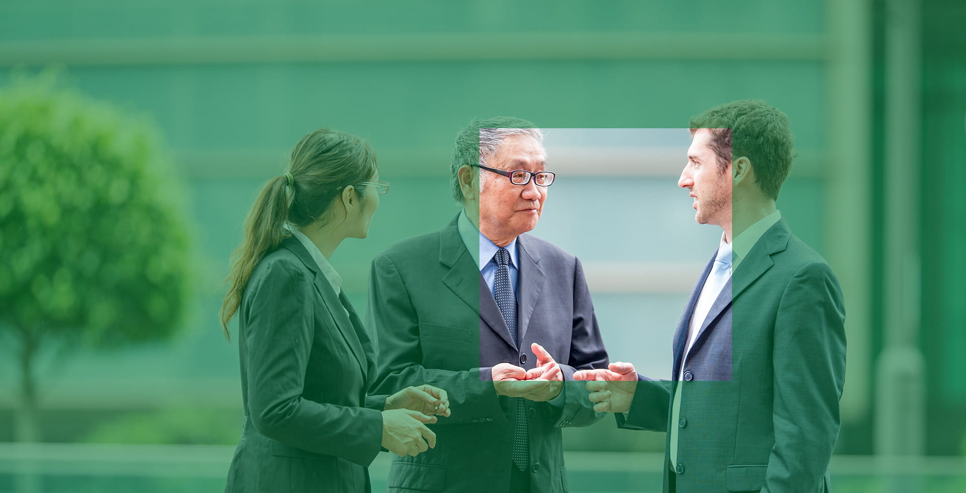 Three business people discussing